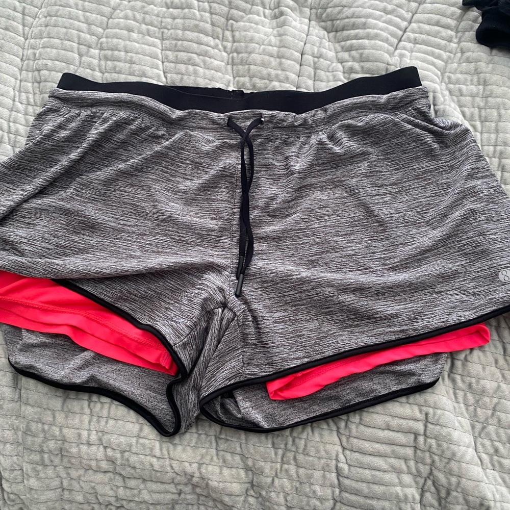 Grey and hot pink running shorts